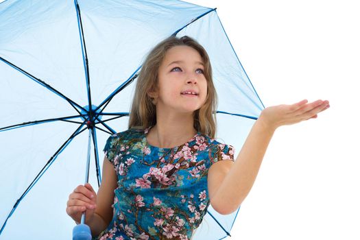 A cute little girl hid under an umbrella and held out her hand, She looks It is raining. The concept of changing the weather. Isolated on white background.