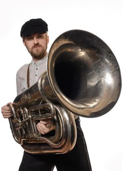 beard man with suspenders and cap holding the tube