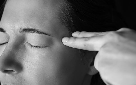 Sad woman makes gesture shot gun in a head