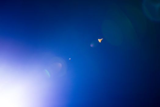 Flash of a distant abstract star. Abstract sun flare. The lens flare is subject to digital correction. - Image