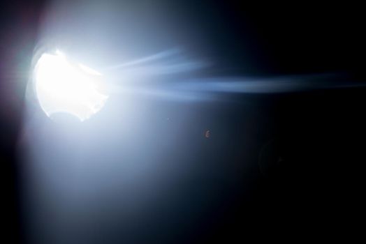 Flash of a distant abstract star. Abstract sun flare. The lens flare is subject to digital correction. - Image