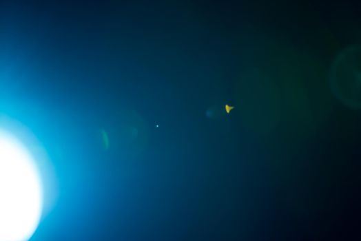 Flash of a distant abstract star. Abstract sun flare. The lens flare is subject to digital correction. - Image