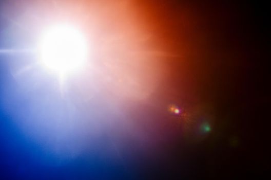 Abstract Natural Sun flare or Far star on the black background - image