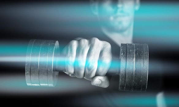 Muscular man holds dumbbell, focus on dumbbell, monochrome image