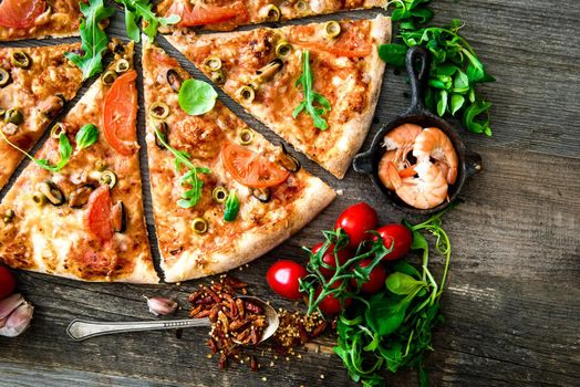delicious pizza with seafood on wooden table