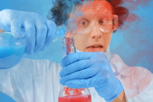 Crazy man scientist is pouring chemical liquid into laboratory tube