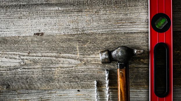 building tools on wooden table on side