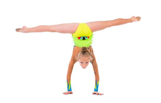 little gymnast standing on hands isolated on white background