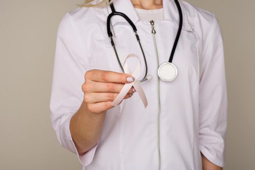 Female doctor in white uniform with ribbon - Image