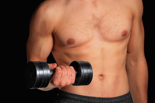 Muscular sportsman exercises with metal dumbbell, fitness, face is not visible