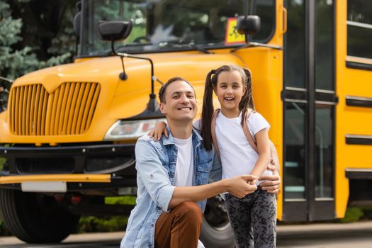 Happy day of back to school. Smiling father taking child to primary school.