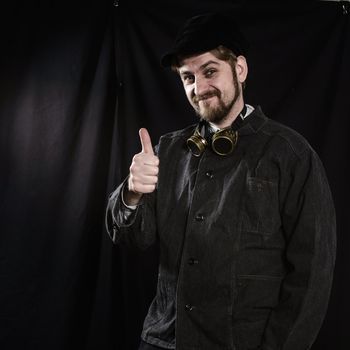 young beard worker welder going thumb up