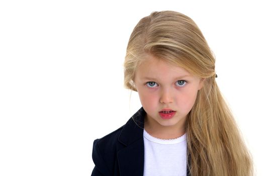 Close up portrait of cute schoolgirl. Beautiful blonde long haired girl posing against white background and looking to the side. Cute elementary school student in blue jacket and white blouse