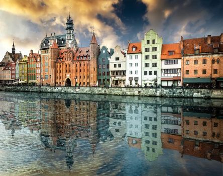 Cityscape on the Vistula River in historic city of Gdansk at sunset in Poland