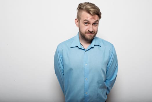 Business man in blue shirt standing apron.