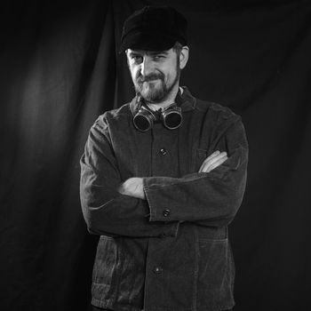 beard welder with arms crossed on his chest