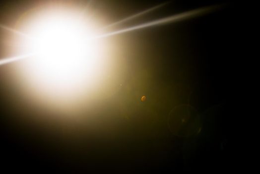 Flash of a distant abstract star. Abstract sun flare. The lens flare is subject to digital correction. - Image