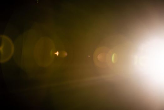 Flash of a distant abstract star. Abstract sun flare. The lens flare is subject to digital correction. - Image