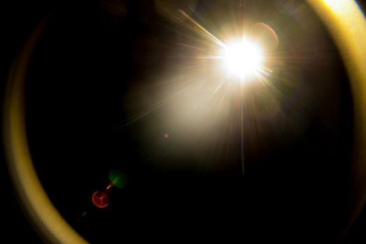 Abstract Natural Sun flare on the black.