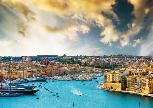 beautiful panoramic view on Valletta from the sea at sunset in Malta
