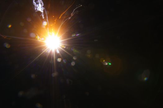 Abstract imitation sun starlight distant galaxy on a black background. -image
