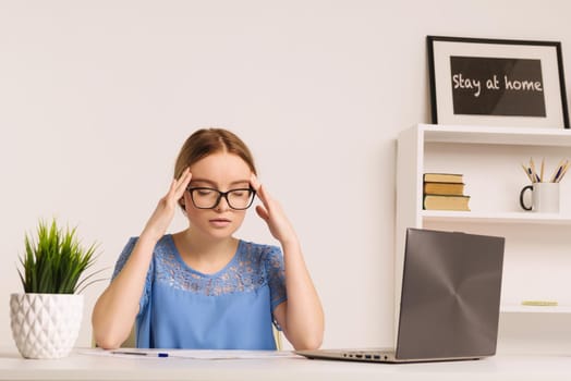 Portrait of tired businesswoman having headache at workplace after working with computer for a long time - Image