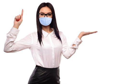 Business woman in glasses and protective mask presenting isolated on white background.