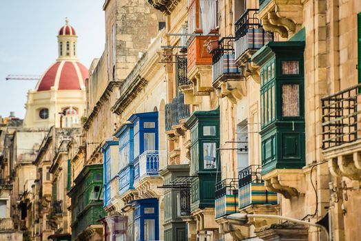 street with colorful balconies in historical part of Valletta in Malta