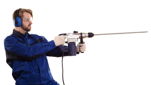 Construction worker with a puncher stands sideways on a white background.