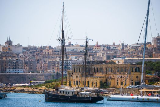 ship in the Valletta port in Malta on the background of the city