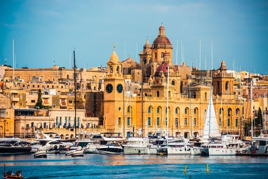 beautiful view on Birgu and the harbour with colorful boats in Malta