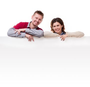 smiling couple lean on empty blanket for ad isolated on white background