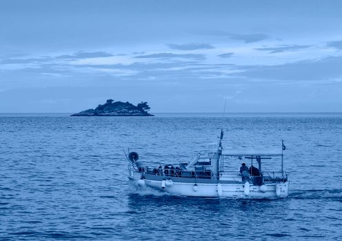 Rovinj, Croatia - May 22, 2018: Harbour and islands of St. Andrew and St. Catherine of old town Rovinj. Istria. Croatia. Europe. Trendy banner toned in classic blue - color of the 2020 year