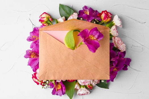 Craft paper envelope with bunch of flowers. High quality photo