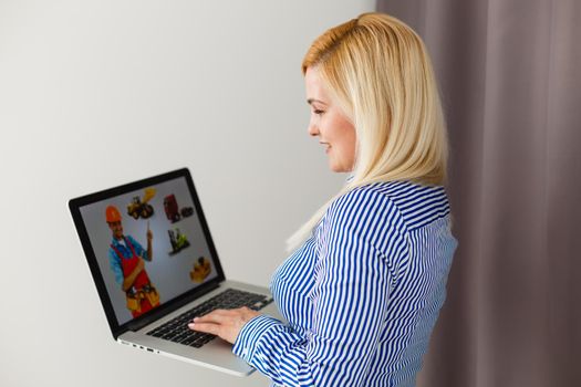 Cropped Image Of Businesswoman Using Laptop At Desk