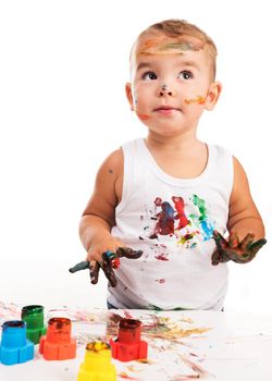 joyful little boy with paints isolated on white background