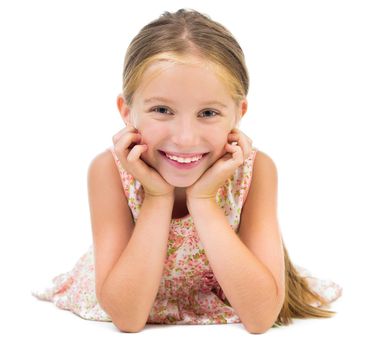 portrait of smiling little girl lying on the floor isolated on white background