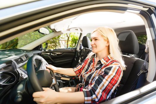 Young woman driving her car