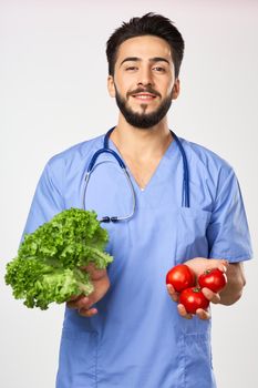 male doctor nutritionist with vegetables in hands healthy food. High quality photo