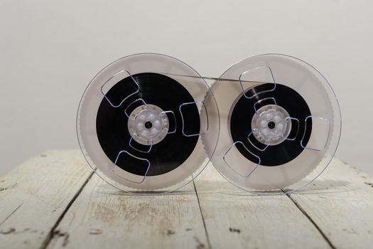 Magnetic tape on old wooden background