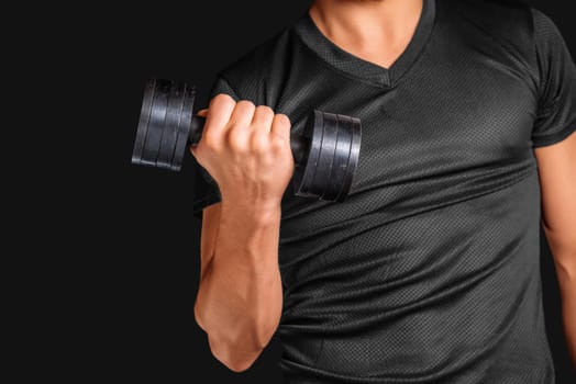 Unrecognizable man exercises with metal dumbbell