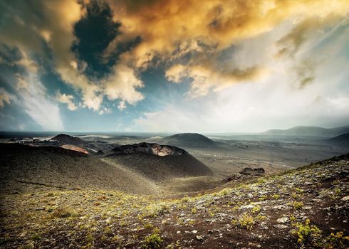 beautiful mountain landscape with volcanoes in Timanfaya National Park at sunset in Lanzarote, Canary Islands