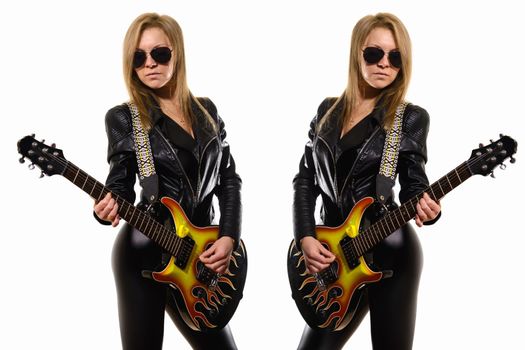 World Music Day. Two beautiful girls in leather jackets play the guitar. Mirroring one young woman in sunglasses