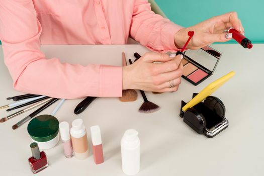 Beauty blogger producing makeup tutorial online translation - image