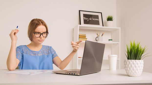 A nervous young businesswoman yelling in white office room- Image