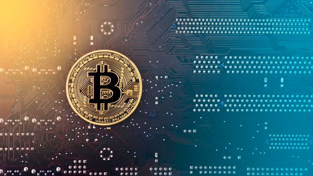 Gold Bitcoin on the back of the motherboard - toned image