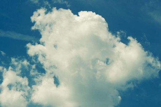 Incredibly wonderful lush cumulus clouds against a blue sky - Image toned