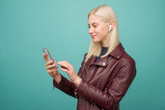 Tula, Russia - May 1, 2019: Happy woman listening music Apple AirPods wireless - Image