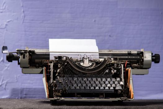 Retro styled image of an old typewriter on a table