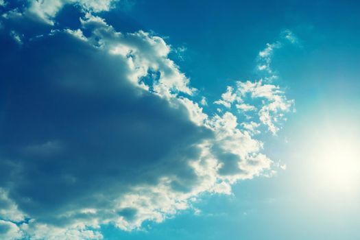 The sun shines bright in summer. Blue sky and clouds.- image